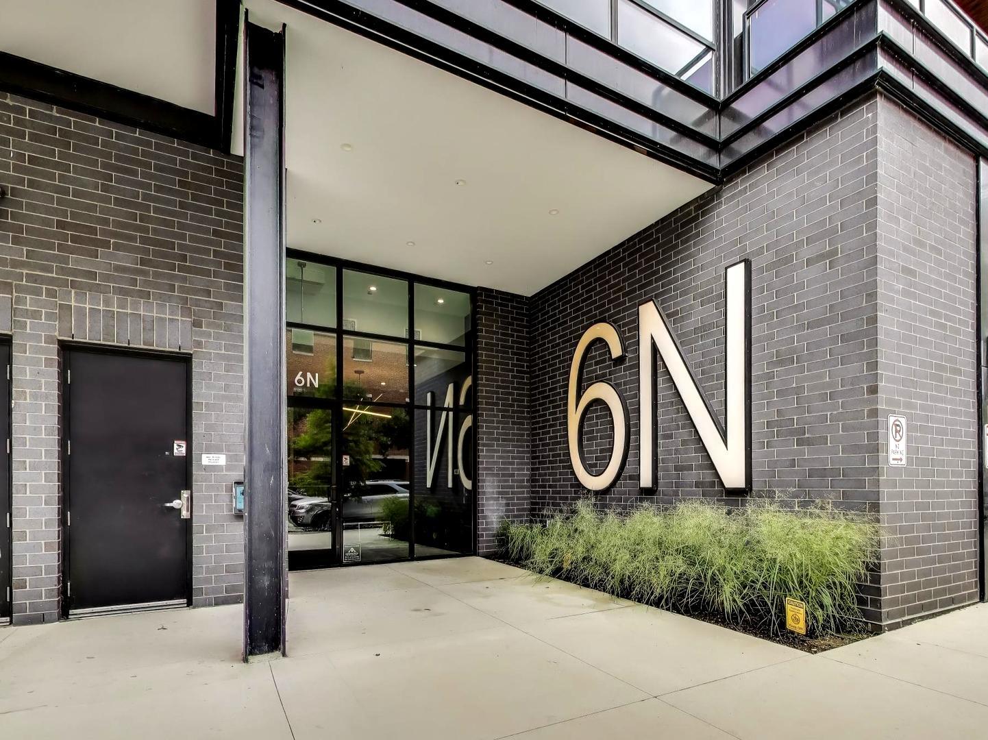 6 North Carpenter Street, Unit 5B Chicago, IL 60607 - Photo 38 of 40 a front view of a house with garden