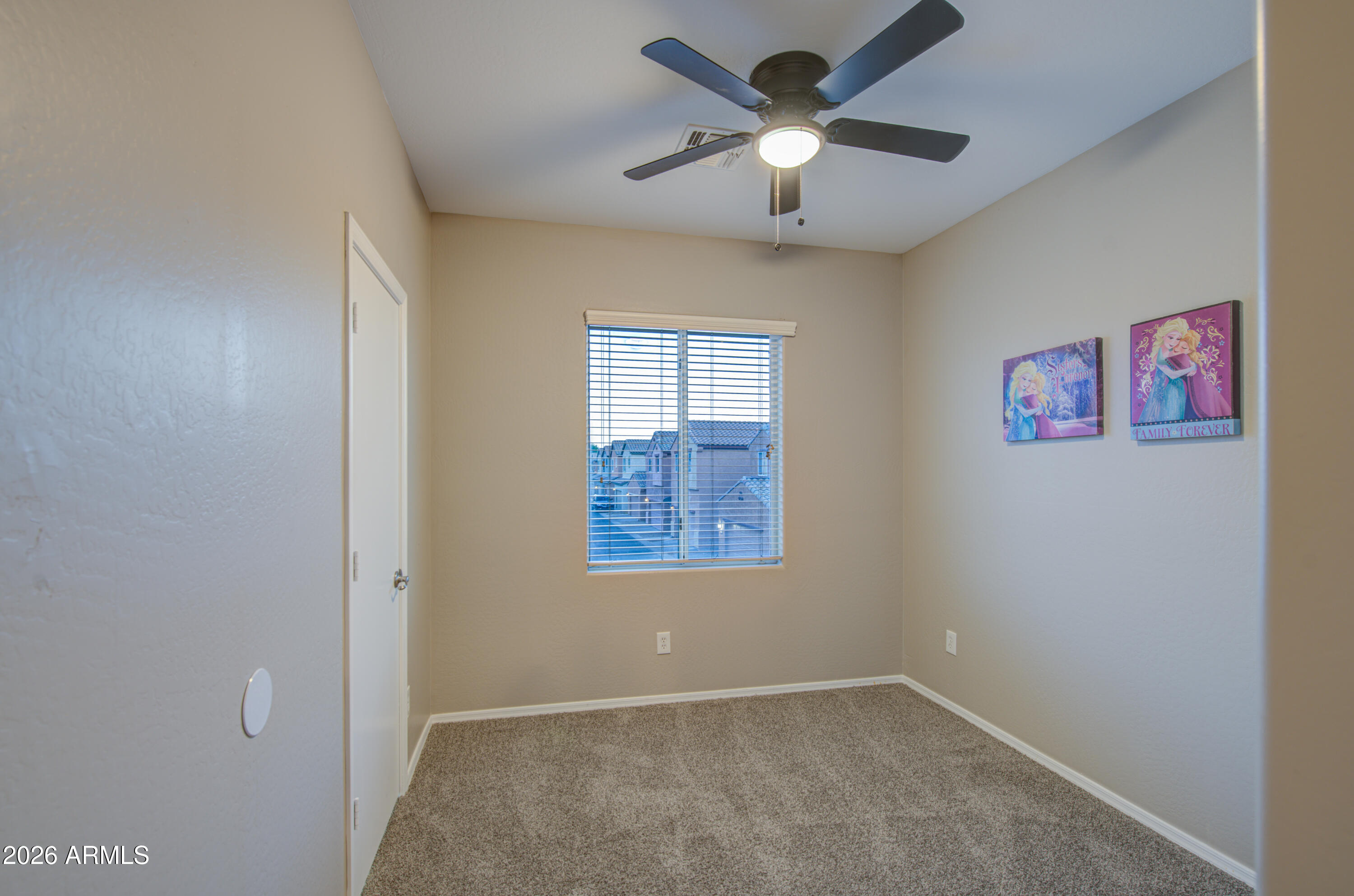 7759 West Monte Vista Road Phoenix, AZ 85035 - Photo 33 of 43 an empty room with windows and fan