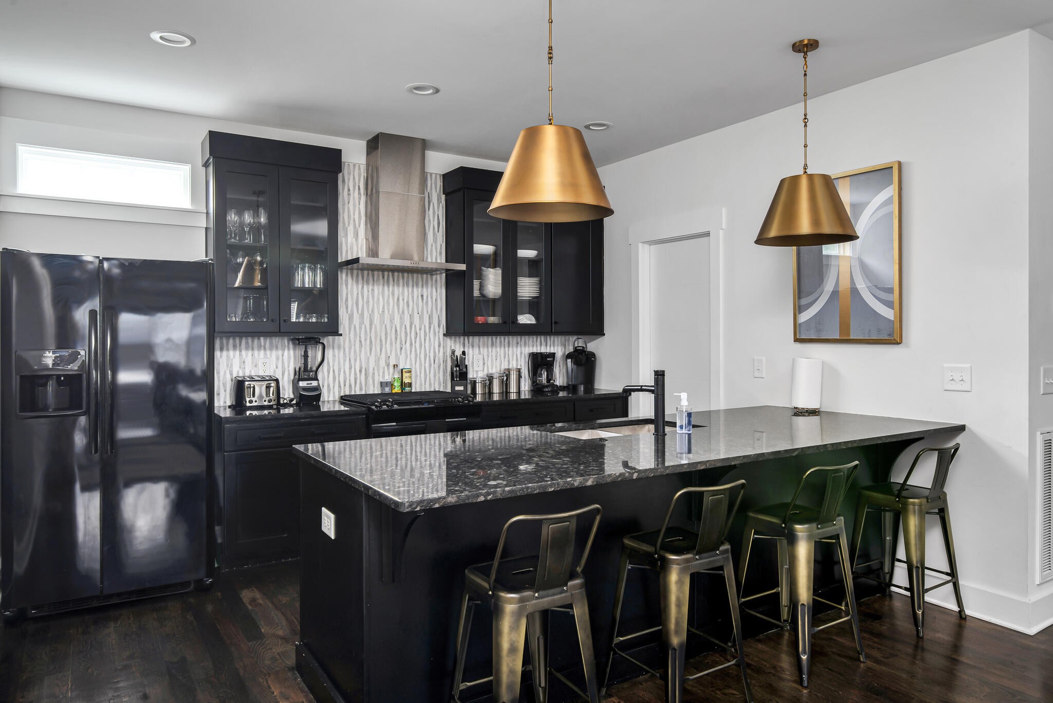 601 Ries Avenue Nashville, TN 37209 - Photo 25 of 30 a kitchen with granite countertop a table chairs stove and cabinets