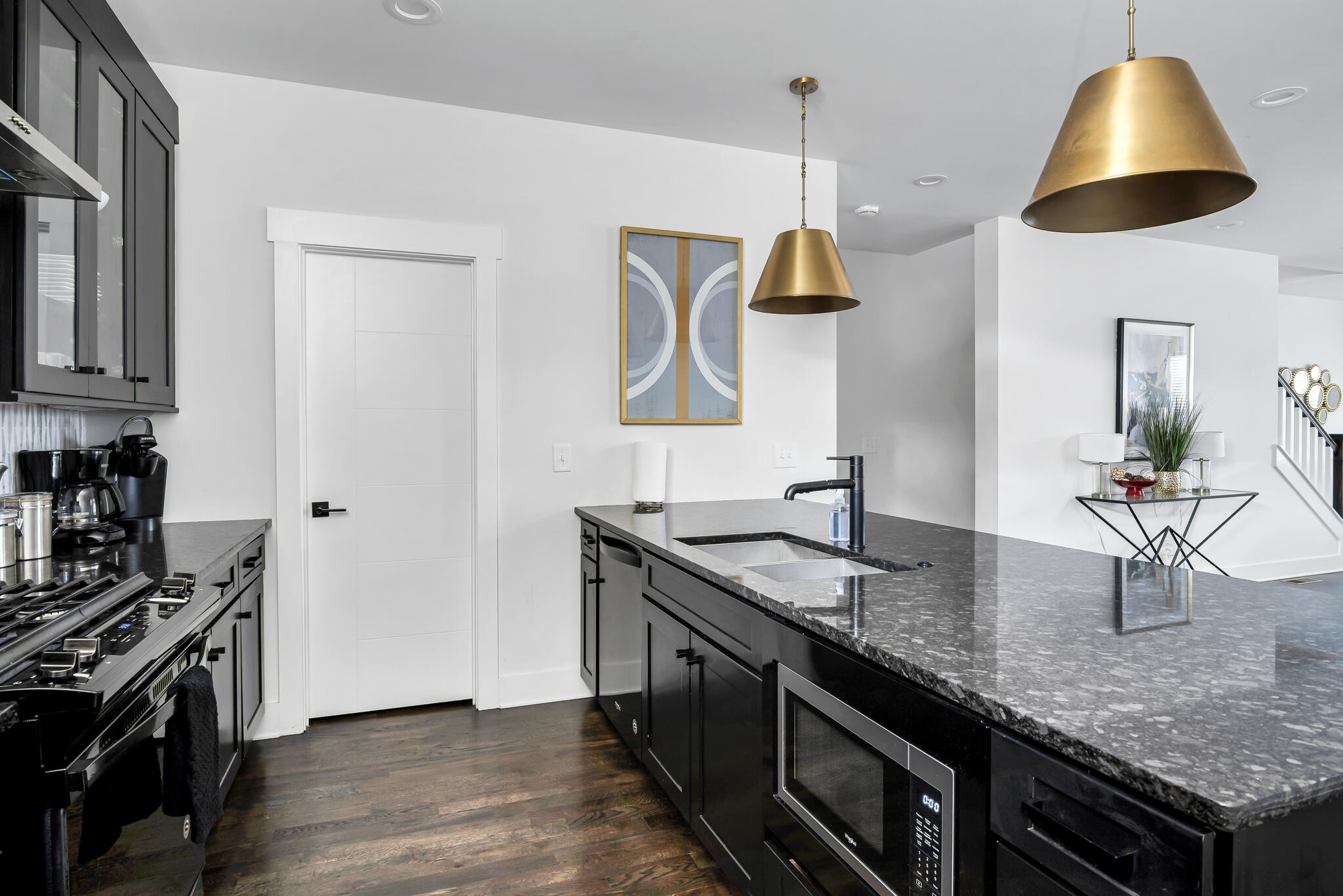 601 Ries Avenue Nashville, TN 37209 - Photo 26 of 30 a kitchen with granite countertop a sink a stove and cabinets