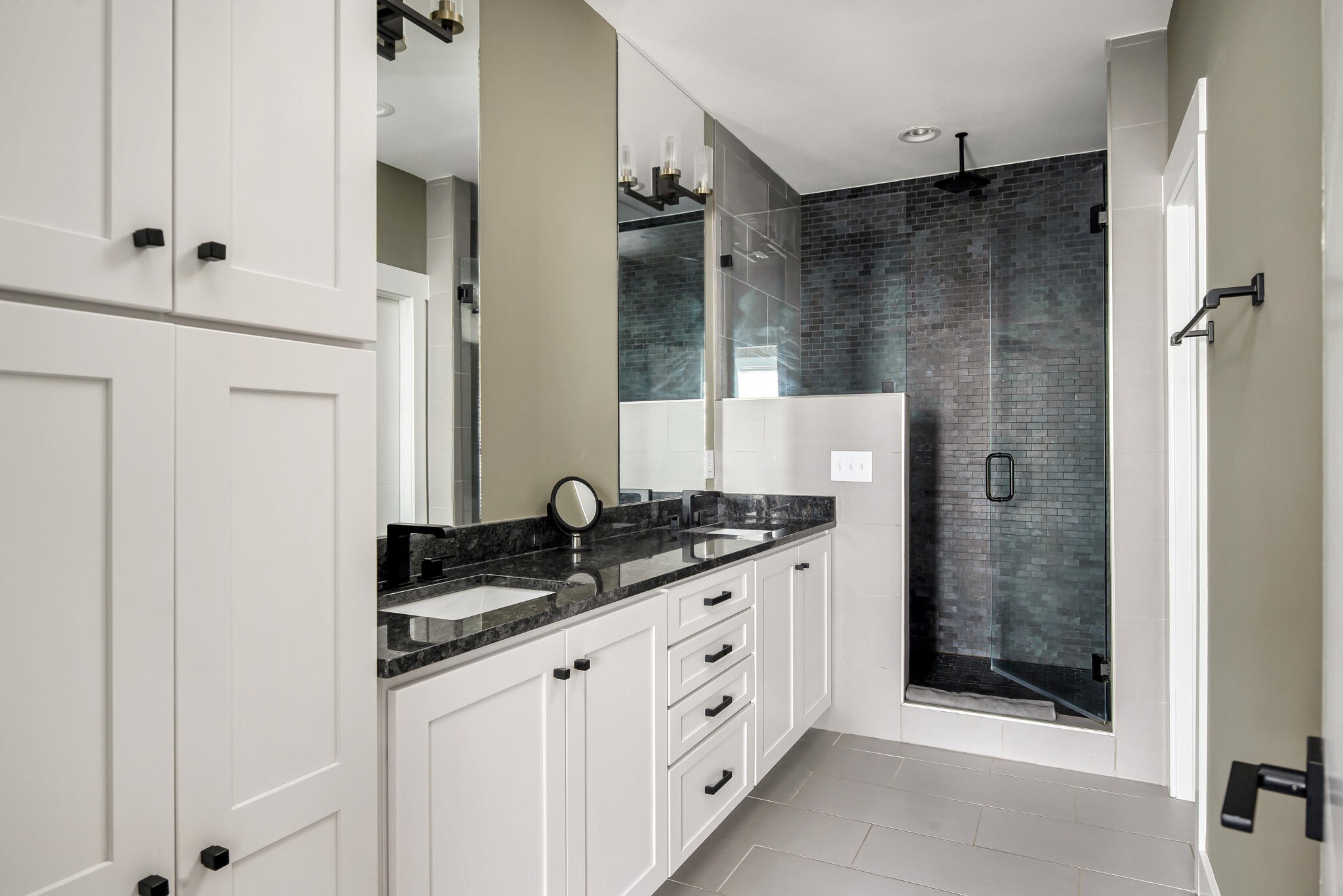 601 Ries Avenue Nashville, TN 37209 - Photo 29 of 30 a bathroom with a granite countertop sink a mirror and shower