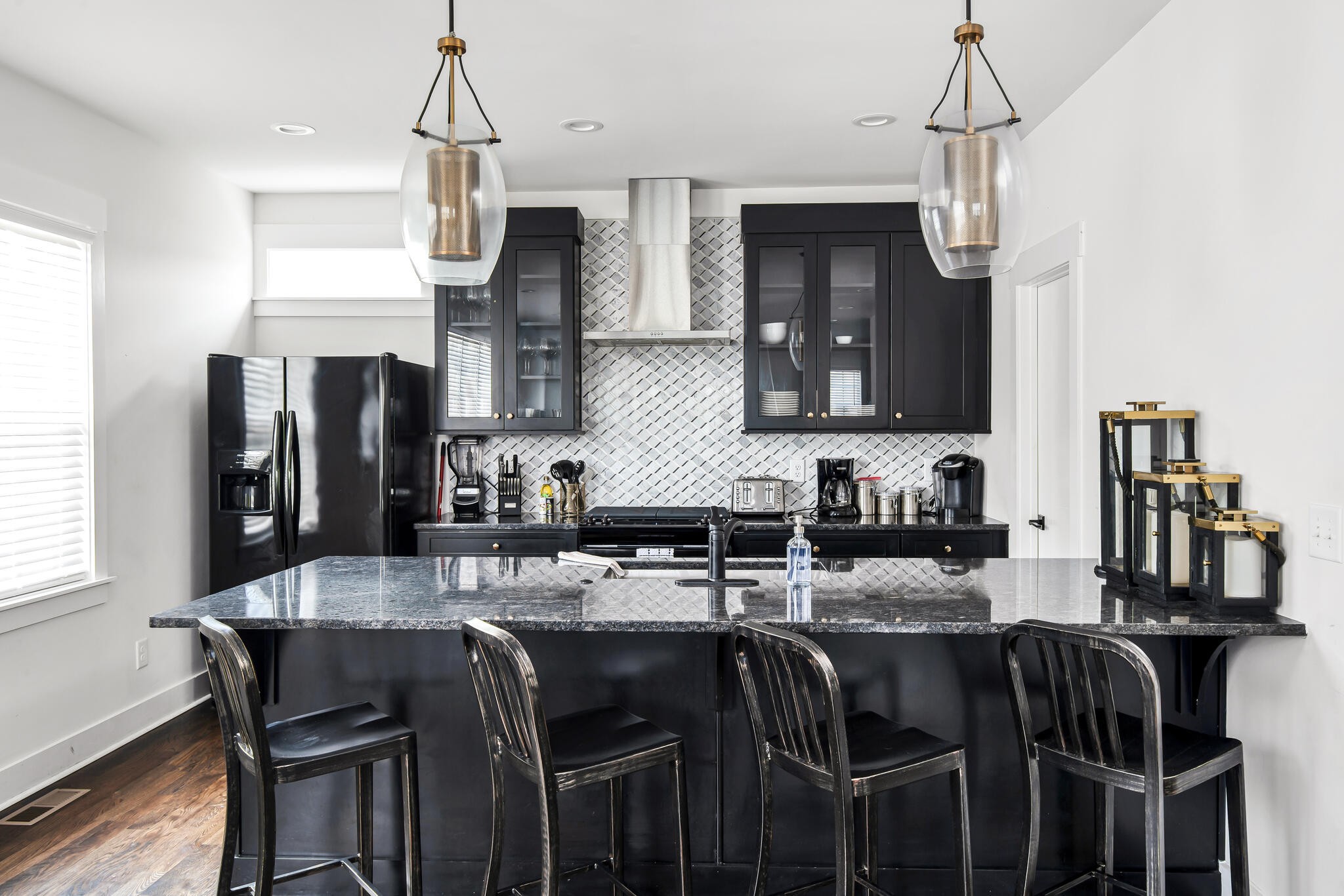 601 Ries Avenue Nashville, TN 37209 - Photo 8 of 30 a kitchen with granite countertop a table chairs microwave and cabinets