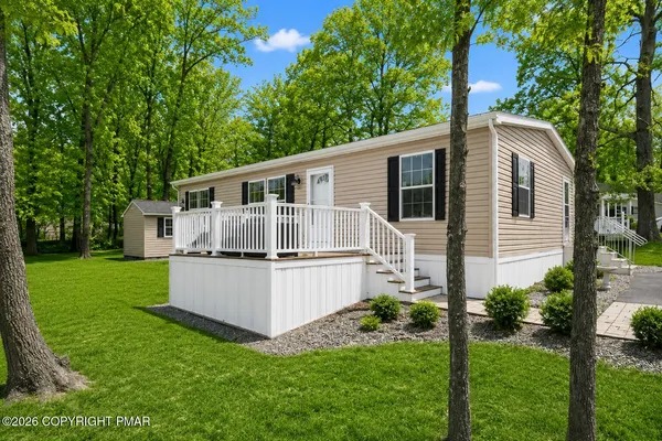 a house that is sitting in the grass