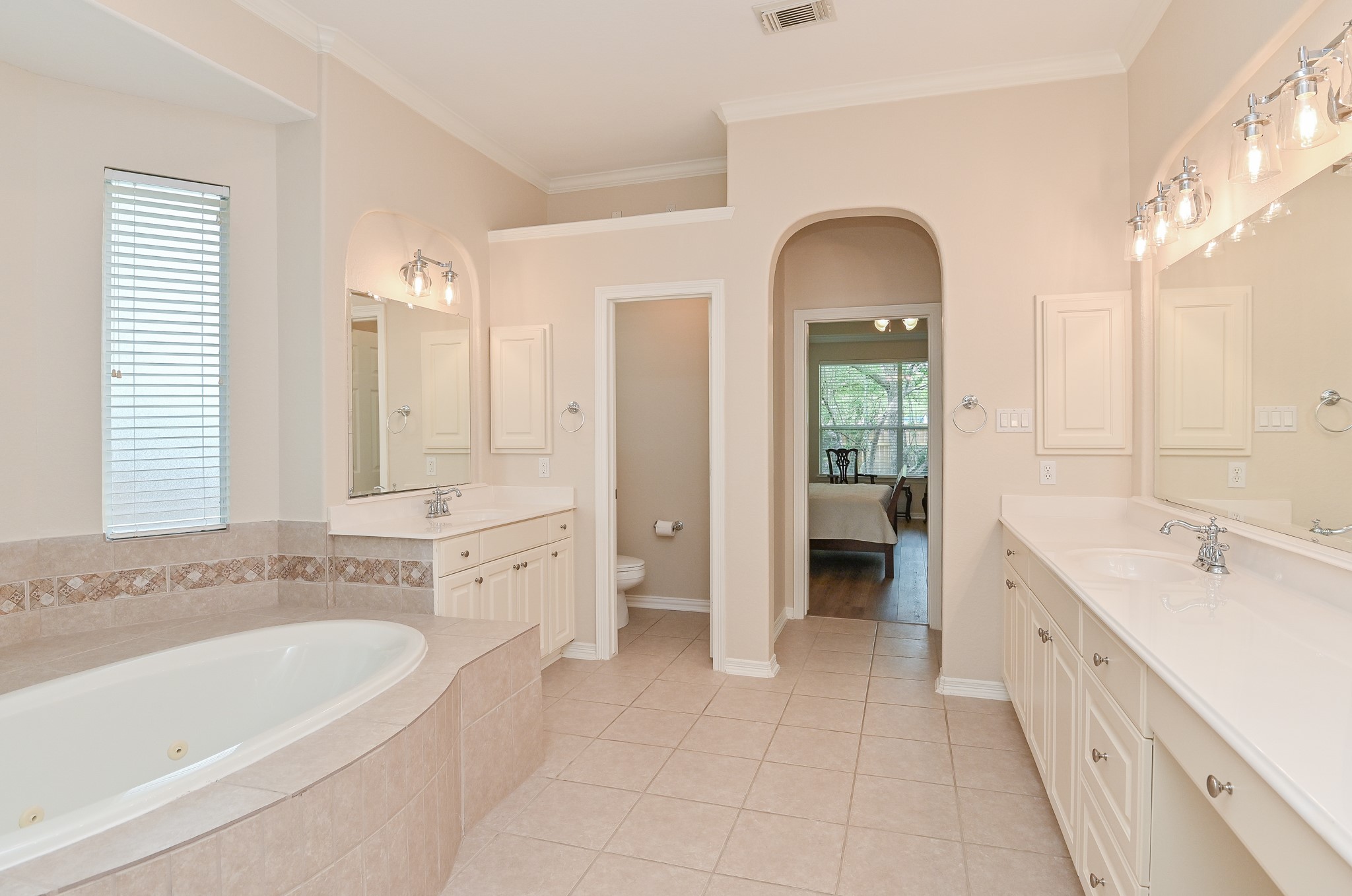 7218 Spring Run Lane Katy, TX 77494 - Photo 19 of 49 a spacious bathroom with a double vanity sink and a bathtub