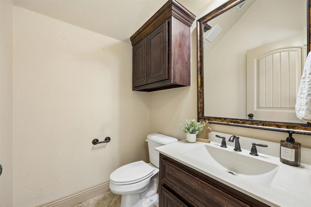 1341 Canary Lane Forney, TX 75126 - Photo 28 of 34 Half bath on lower level. Note there is a walk in closet behind it. This bath could convert into a full bath,