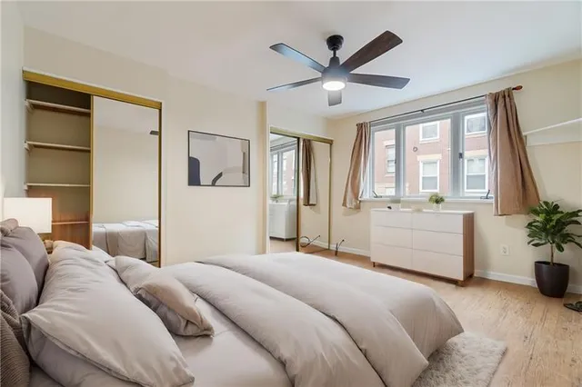 a bedroom with a large bed and a large window