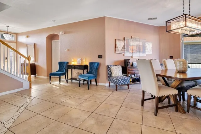 a outdoor space with chairs a couch and a potted plant