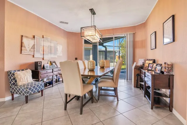a dining room with furniture and window