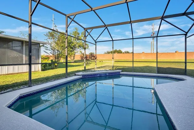 a view of a bathroom with a window and wooden floor