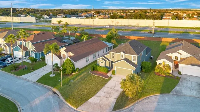 an aerial view of a house with a ocean view