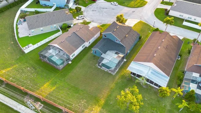 an aerial view of a house with a swimming pool