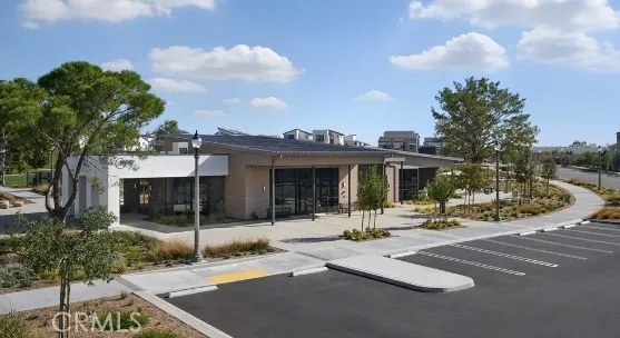a view of a patio with couches and table and chairs and potted plants