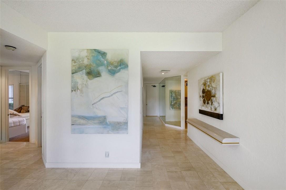 5887 Northwest 24th Avenue, Unit 1201 Boca Raton, FL 33496 - Photo 8 of 47 END OF LIVING ROOM, ENTRY