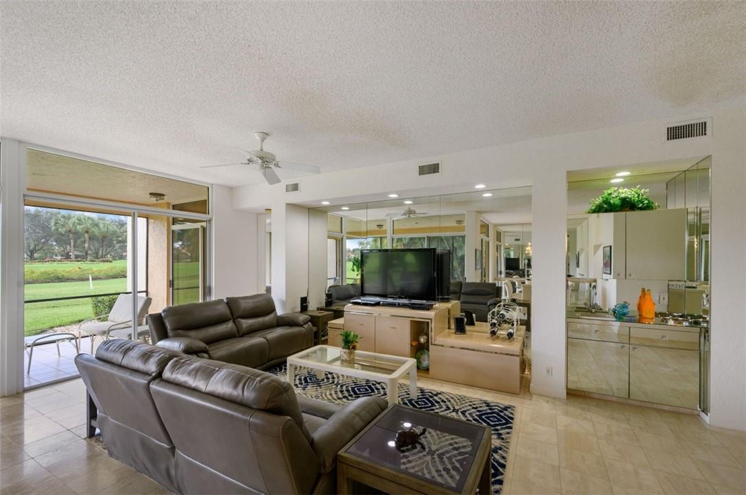5887 Northwest 24th Avenue, Unit 1201 Boca Raton, FL 33496 - Photo 10 of 47 LIVING ROOM, WET BAR