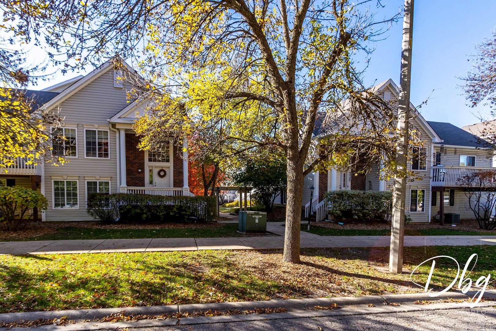31 South Treehouse Lane, Unit 31 Round Lake, IL 60073 - Photo 2 of 26 a front view of a house with a yard