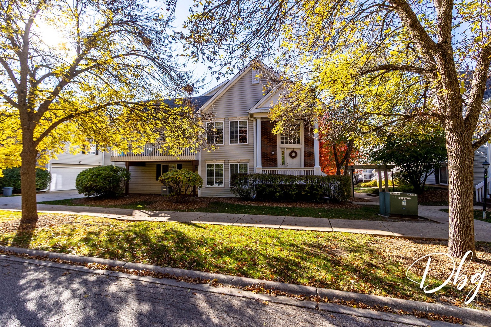 31 South Treehouse Lane, Unit 31 Round Lake, IL 60073 - Photo 23 of 26 a view of a house with swimming pool next to a yard
