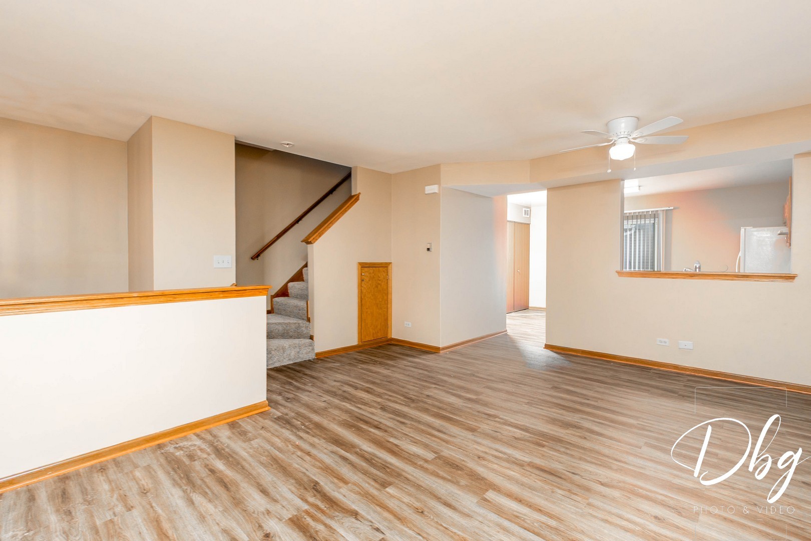 31 South Treehouse Lane, Unit 31 Round Lake, IL 60073 - Photo 6 of 26 a view of an empty room with wooden floor and a window