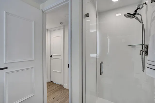 a bedroom with a bed window and a desk