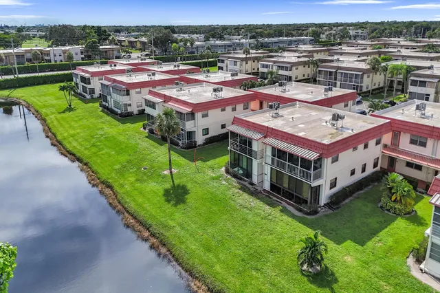 a view of a city street houses and lake view