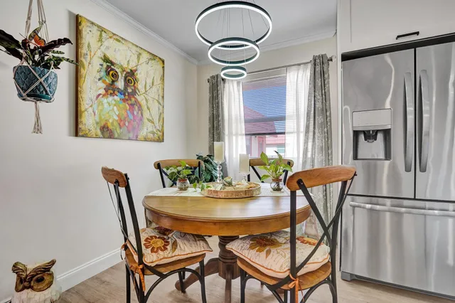 a dining room with furniture and window