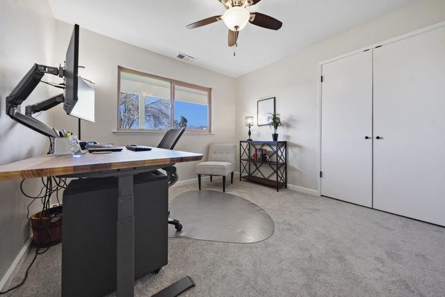 a view of a workspace with furniture