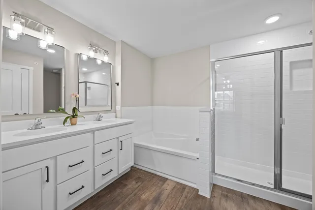 a bathroom with a bathtub and a shower