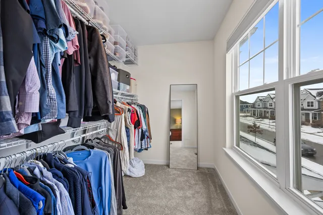 a bedroom with furniture and a book shelf