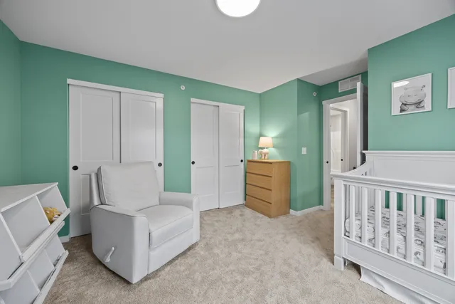 a bathroom with a sink mirror and toilet