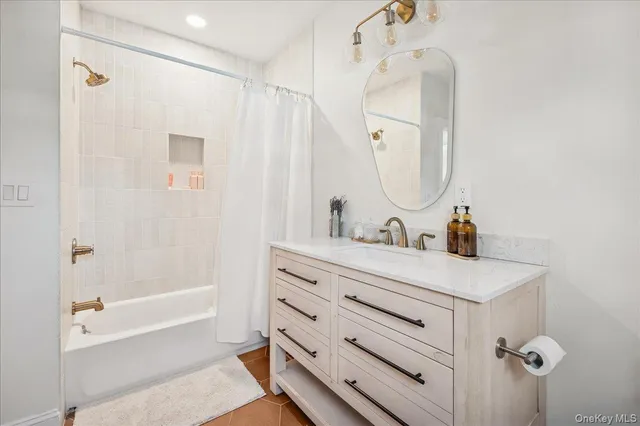 a bathroom with a sink toilet and window