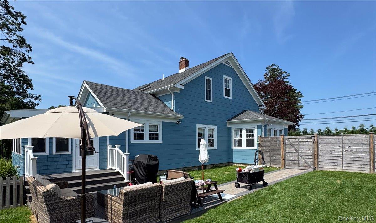 36 Atlantic Avenue Blue Point, NY 11715 - Photo 36 of 46 South side yard with deck and room for garage