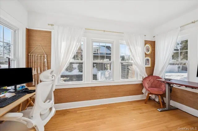 a living room with stainless steel appliances furniture and a table