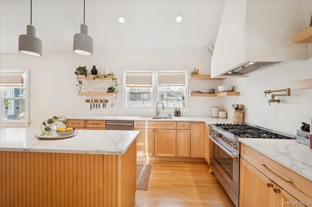 a kitchen with cabinets a sink and appliances