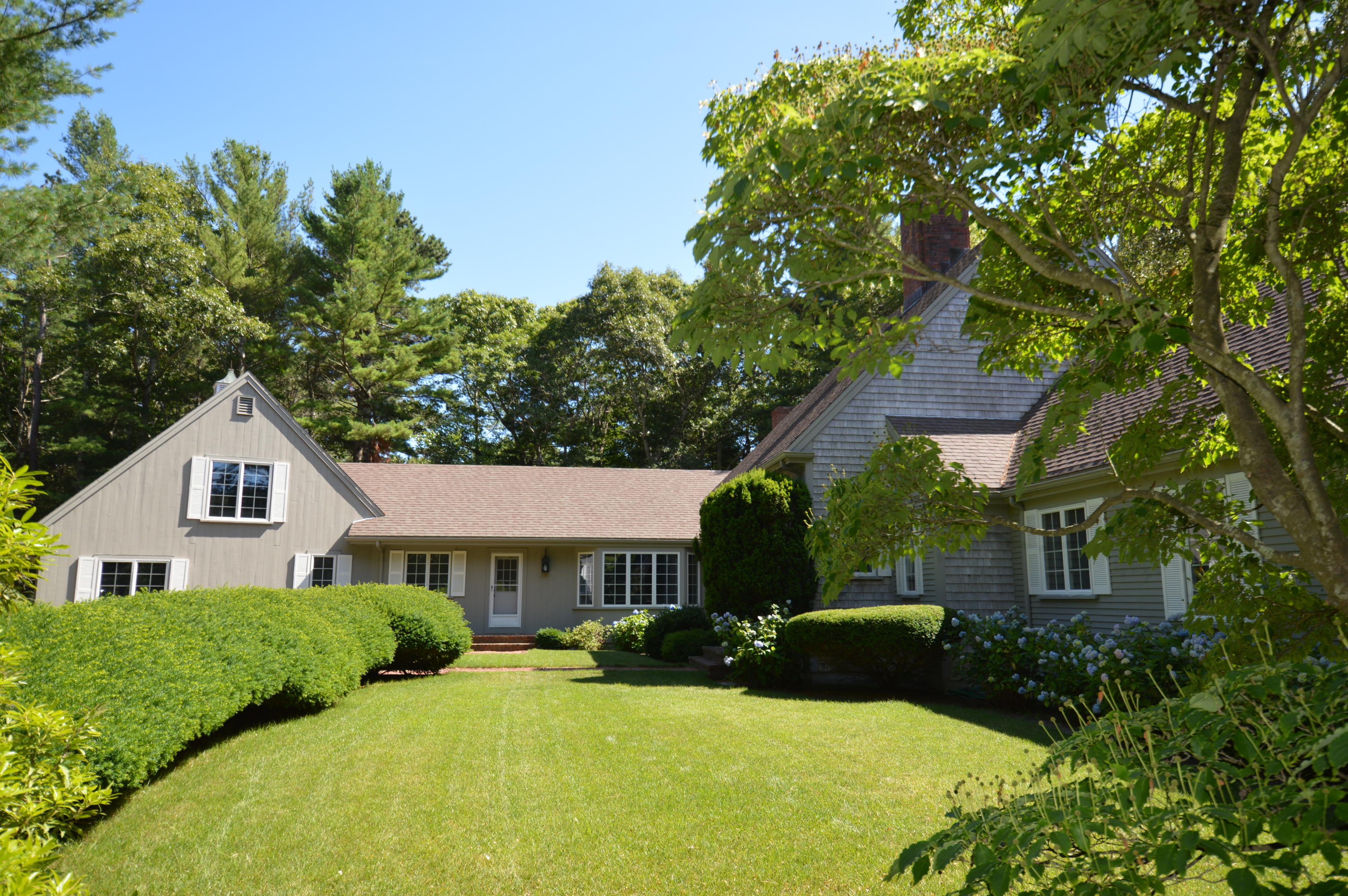 25 Oakdale Path Osterville, MA 02655 - Photo 1 of 21 a front view of a house with yard and green space
