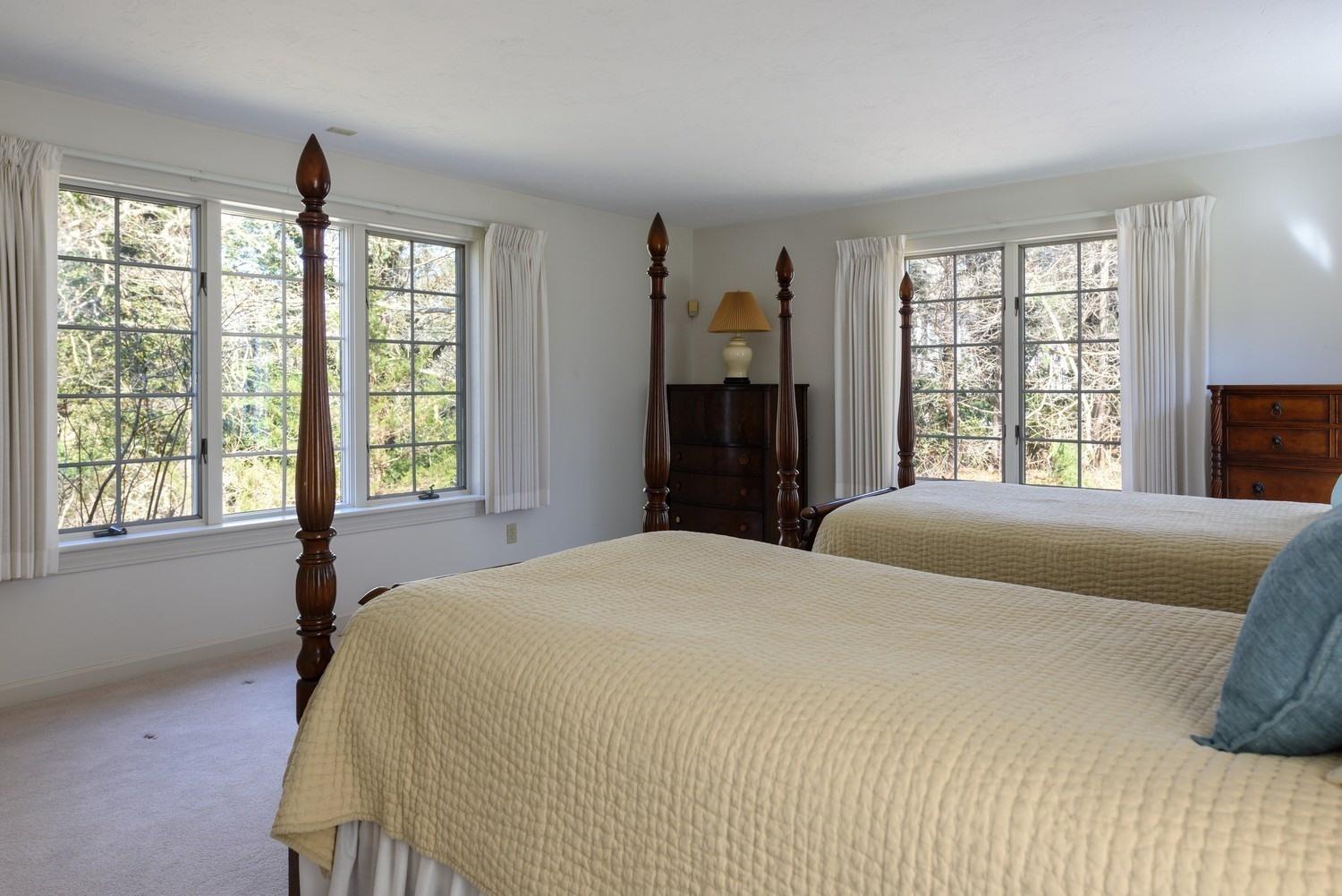 25 Oakdale Path Osterville, MA 02655 - Photo 15 of 21 a bedroom with a large bed and a window