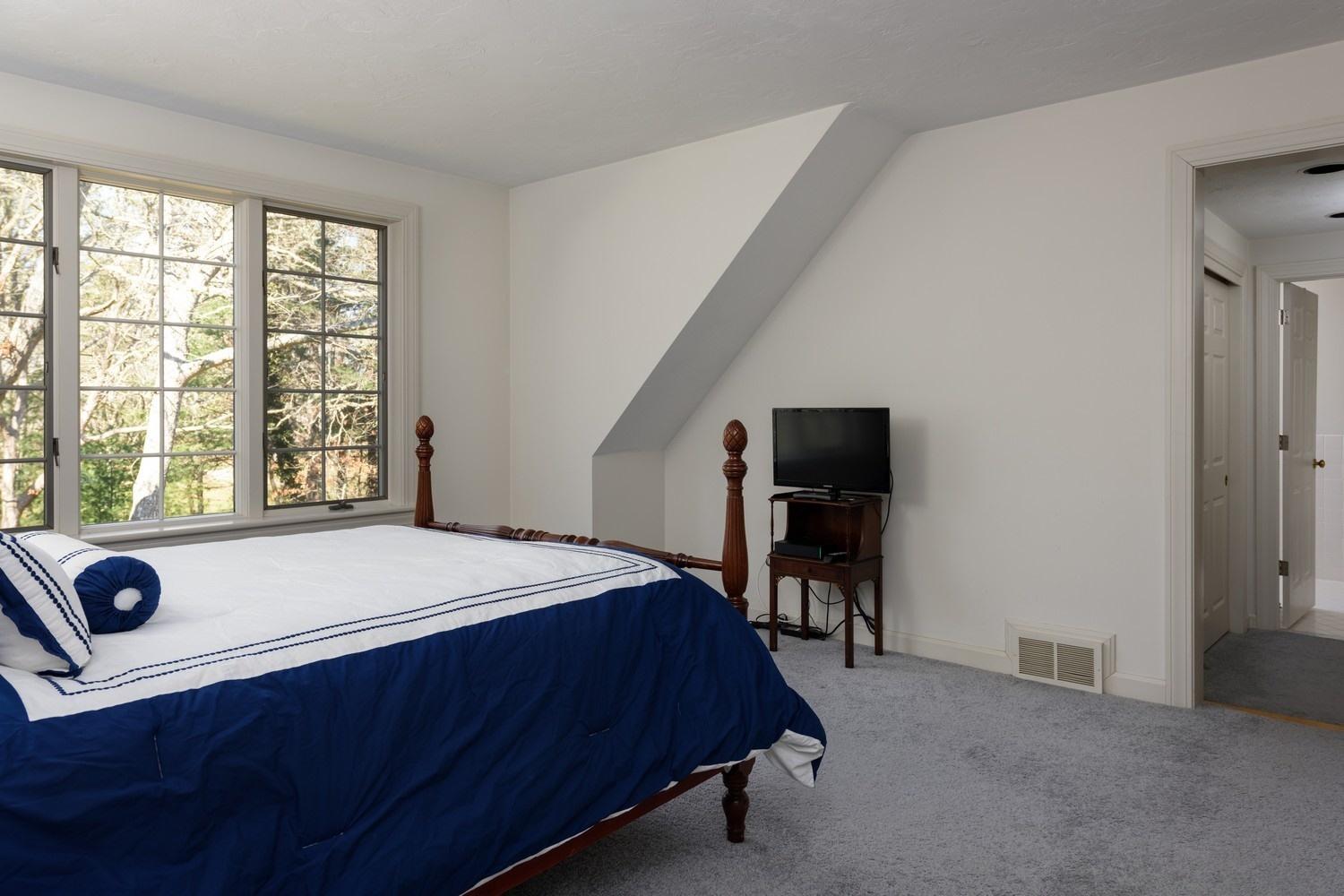 25 Oakdale Path Osterville, MA 02655 - Photo 16 of 21 a bed sitting in a bedroom next to a window