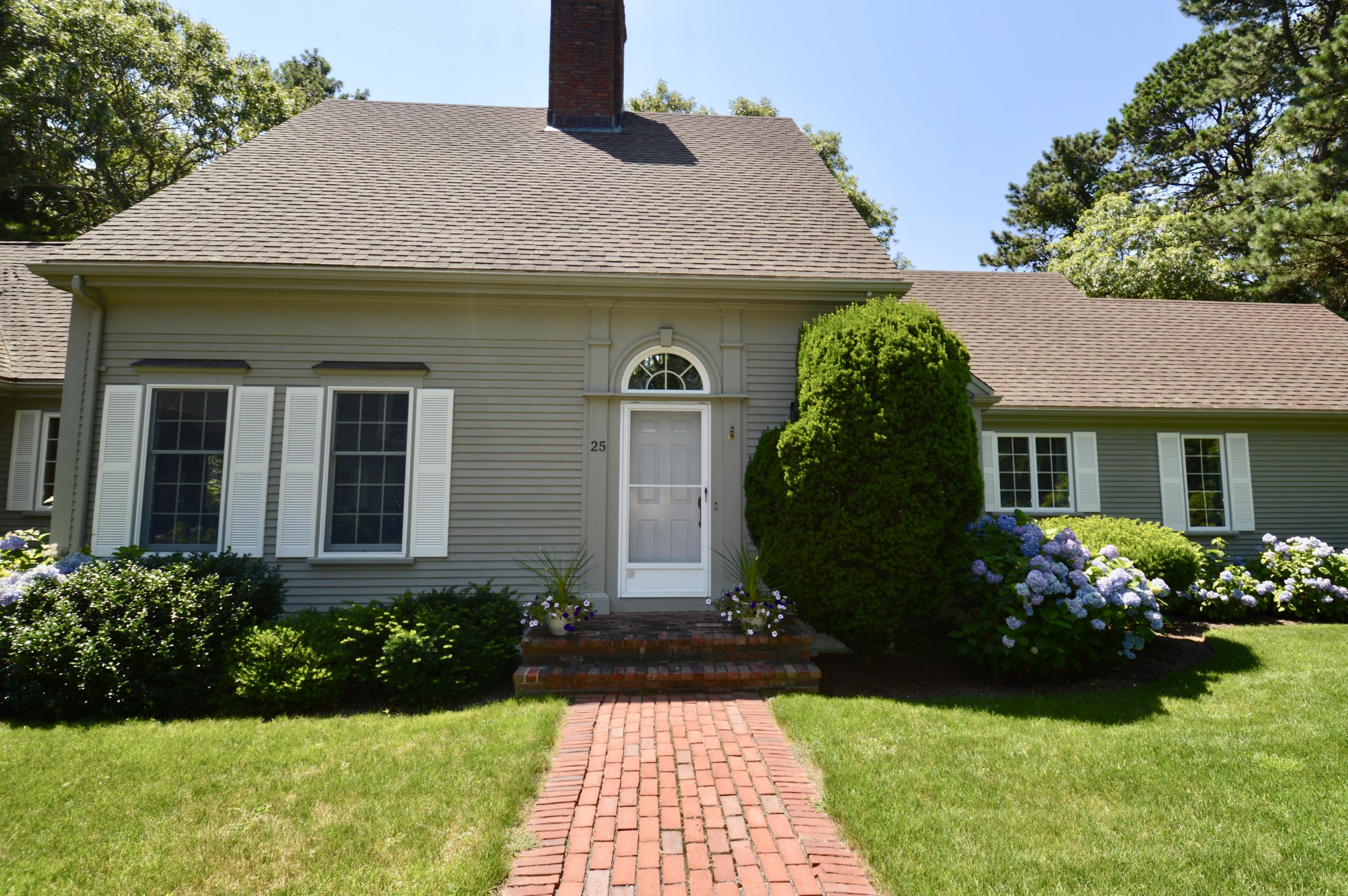 25 Oakdale Path Osterville, MA 02655 - Photo 3 of 21 a front view of a house with garden