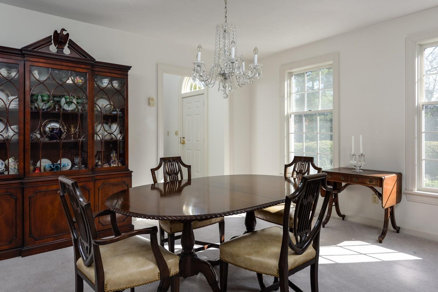 25 Oakdale Path Osterville, MA 02655 - Photo 5 of 21 a view of a dining room with furniture and chandelier