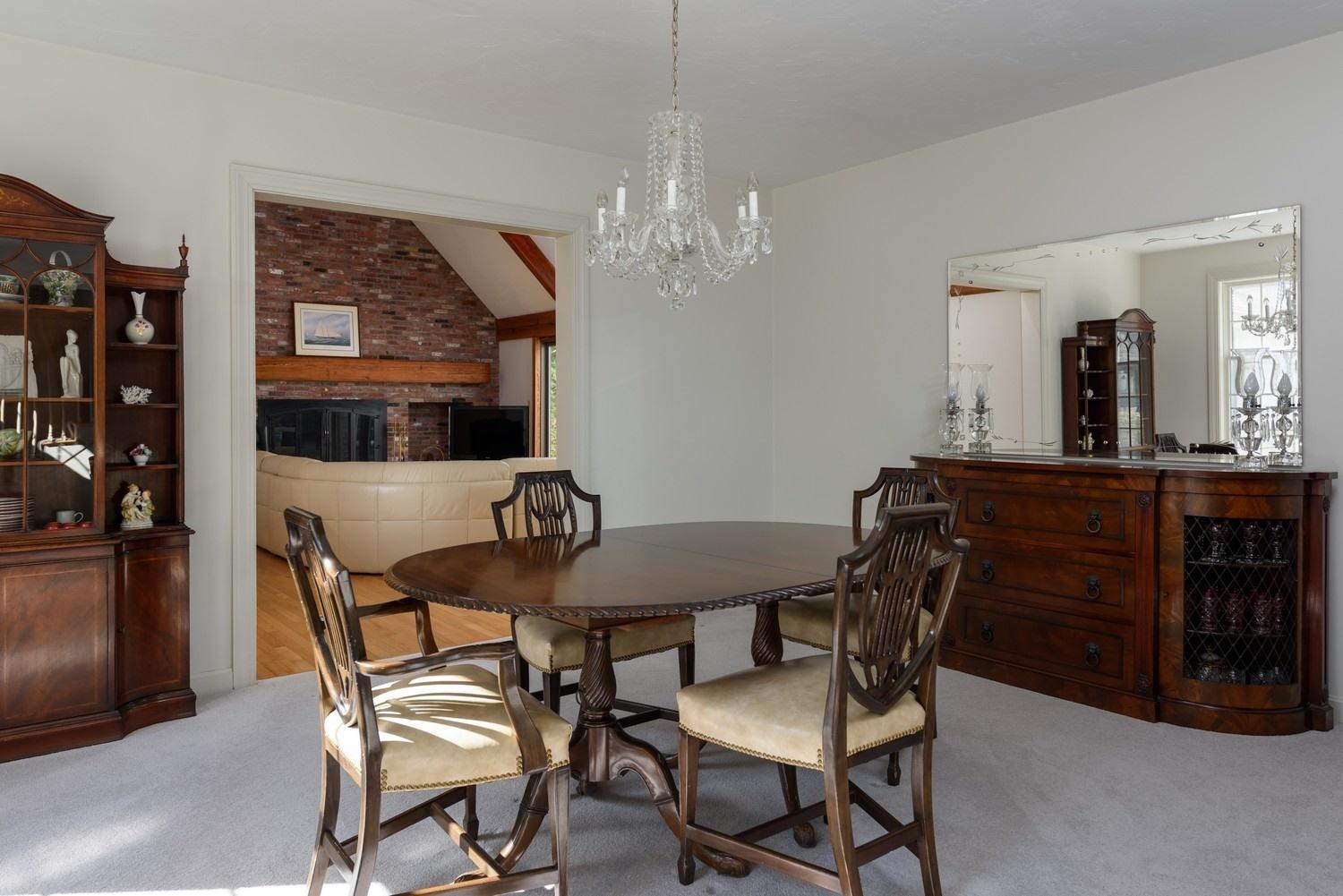 25 Oakdale Path Osterville, MA 02655 - Photo 6 of 21 a view of a dining room with furniture and chandelier