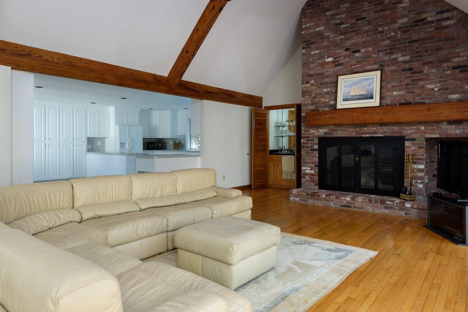 25 Oakdale Path Osterville, MA 02655 - Photo 7 of 21 a living room with furniture and a fireplace