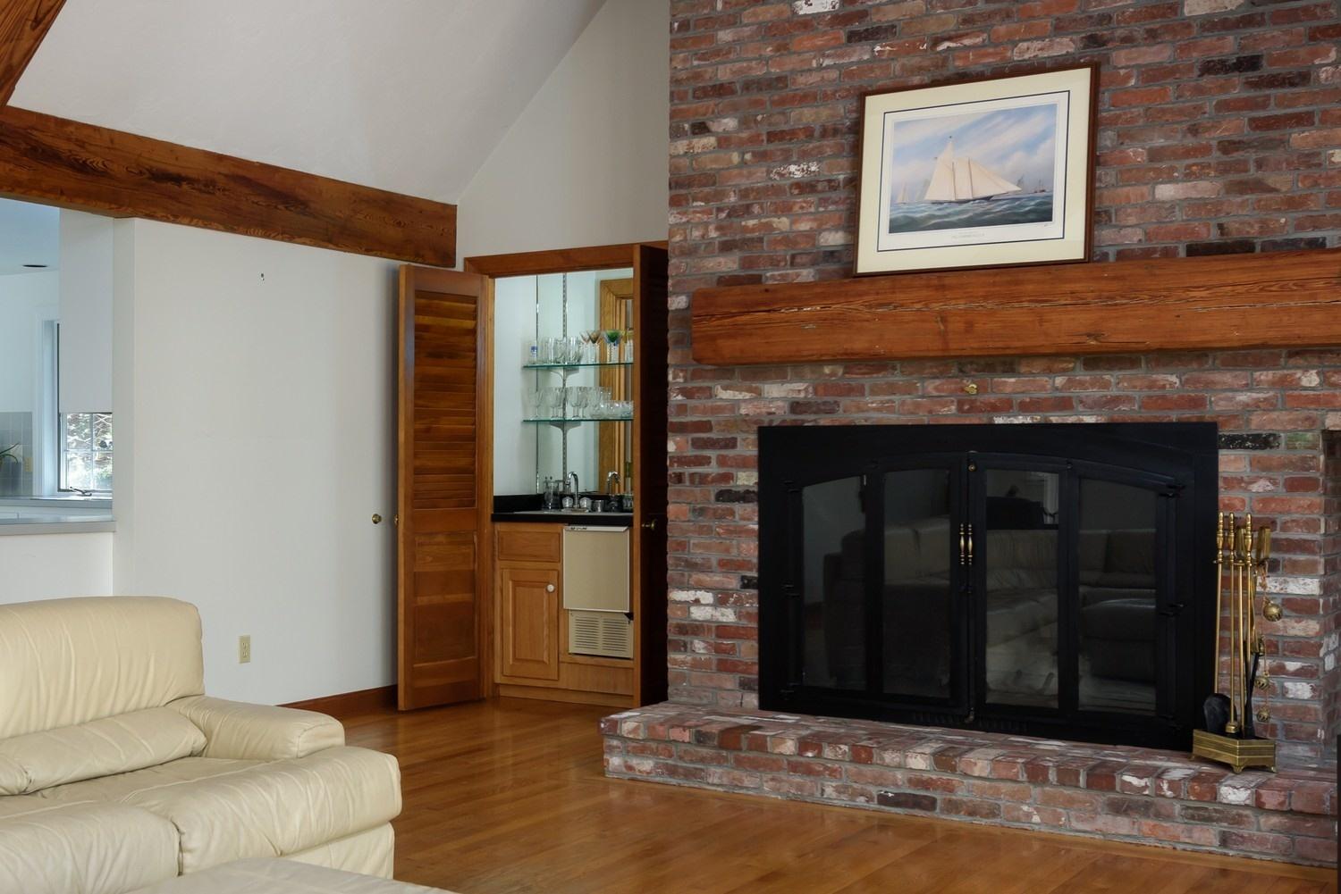 25 Oakdale Path Osterville, MA 02655 - Photo 8 of 21 a living room with furniture and a fireplace