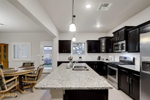 a living room with furniture and a ceiling fan