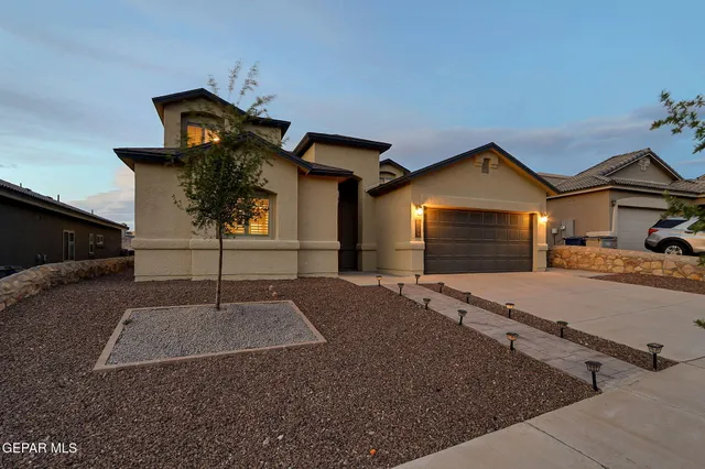 a front view of a house with yard