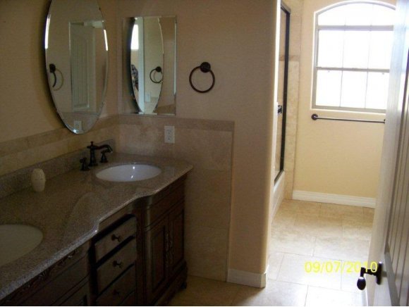 3680 West L Bar L Road Prescott, AZ 86305 - Photo 12 of 24 a bathroom with a sink vanity and a mirror