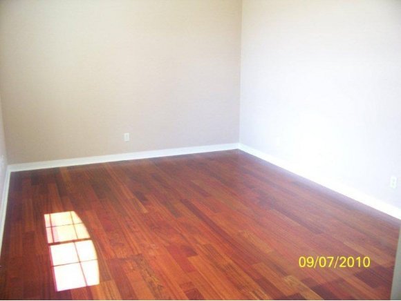 3680 West L Bar L Road Prescott, AZ 86305 - Photo 14 of 24 a view of an empty room with wooden floor and a window