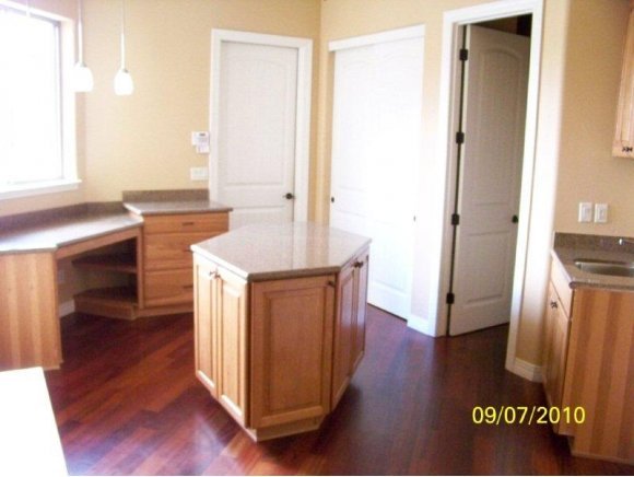 3680 West L Bar L Road Prescott, AZ 86305 - Photo 16 of 24 a kitchen with a refrigerator sink and wooden floor