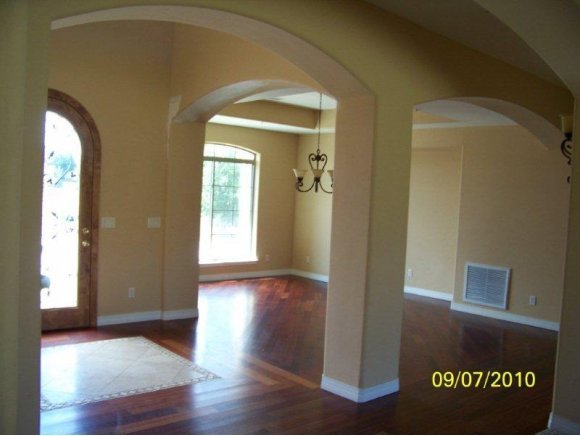 3680 West L Bar L Road Prescott, AZ 86305 - Photo 2 of 24 a view of a hallway with wooden floor and stairs