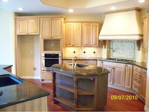 3680 West L Bar L Road Prescott, AZ 86305 - Photo 5 of 24 a kitchen with kitchen island granite countertop a sink stove and cabinets