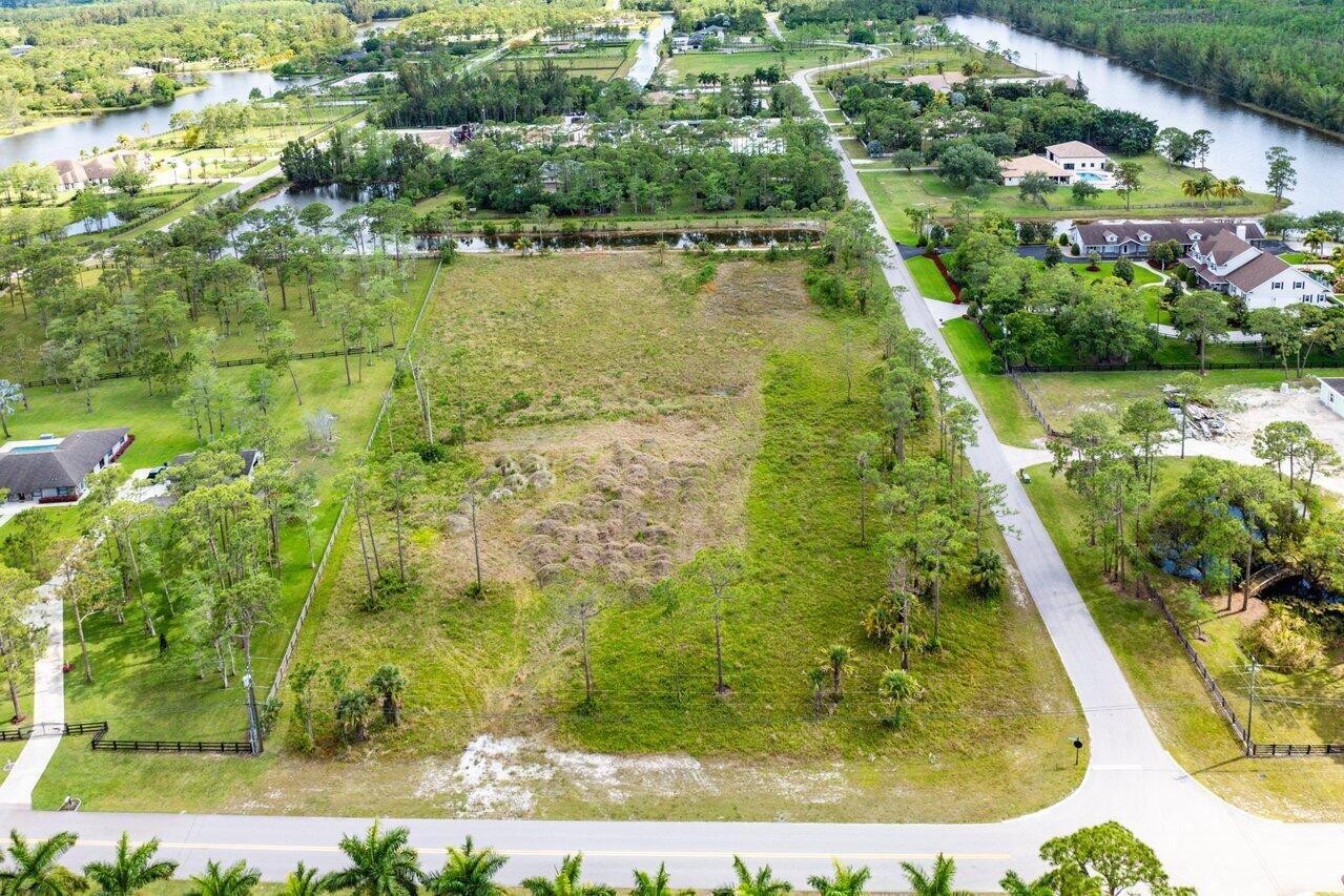 6248 Homeland Road Lake Worth, FL 33449 - Photo 5 of 22 an aerial view of residential houses with outdoor space and swimming pool