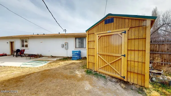 a view of a house with backyard and bathroom