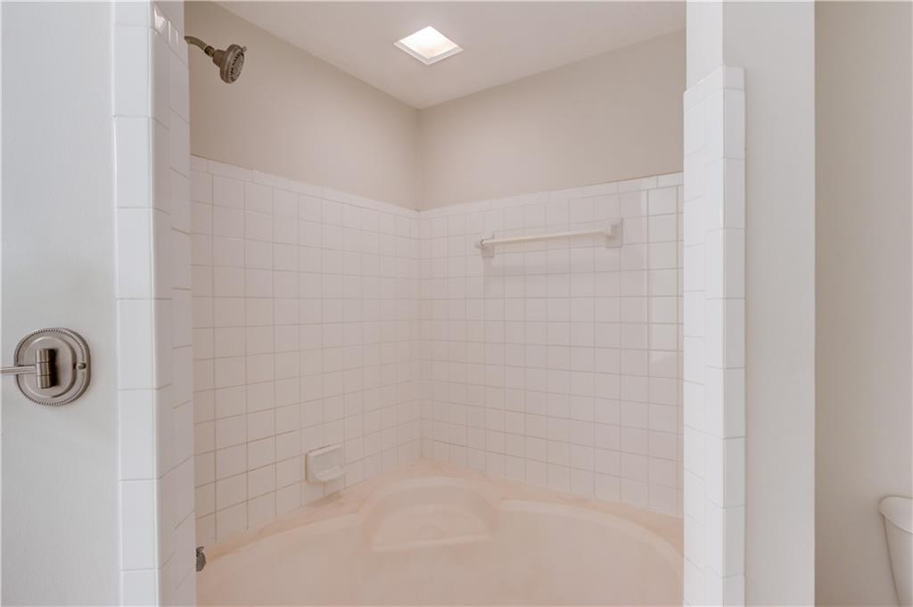 970 Sidney Marcus Boulevard Northeast, Unit 2403 Atlanta, GA 30324 - Photo 23 of 41 a bathroom with a shower